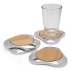 A combination of shining iron-finished nambé metal and natural bamboo gives this handcrafted coaster set from Nambé rustic yet modern appeal.