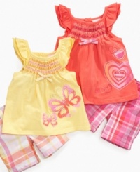 Color her world brightly with one of these fun smocked tunic and bermuda short sets from Nannette. Color her world brightly with one of these fun smocked tunic and bermuda short sets from Nannette.