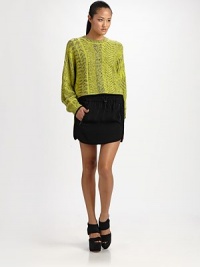 Heathered wool woven in a geometric jacquard, slightly oversized and cropped at the waist.Ribbed crewneckDropped shouldersGathered cuffsPullover styleAbout 20 from shoulder to hem63% wool/29% viscose/7% nylon/1% spandexDry cleanImported Heathered wool woven in a geometric jacquard, slightly oversized and cropped at the waist.Ribbed crewneckDropped shouldersGathered cuffsPullover styleAbout 20 from shoulder to hem63% wool/29% viscose/7% nylon/1% spandexDry cleanImported