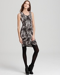 The slinky silhouette and bold abstract pattern of this Three Dots printed dress will carry you well from day to evening. Play up the black-and-white sentiment with a boldly colored pump. The slinky silhouette and bold abstract pattern of this Three Dots printed dress will carry you well from day to evening. Play up the black-and-white sentiment with a boldly colored pump.