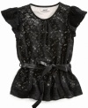 Pretty lace in true lady-like form. She'll don her DKNY ribbon-tie top for every special occasion this season.