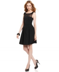 This dress from Tahari by ASL is perfectly feminine with bow-bedecked shoulders and a sheer panel of swiss dots at the chest. This dress from Tahari by ASL is perfectly feminine with bow-bedecked shoulders and a sheer panel of swiss dots at the chest.