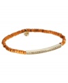 Add the colors of sunset to your wardrobe. Michael Kors' pretty and petite stretch bracelet features semi-precious dyed howlite in brilliant orange hues adorned with a Czech glass-accented charm. Bar and charm accents set in gold tone mixed metal. Approximate diameter: 2-1/4 inches.