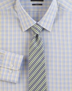 A smart plaid in softened shades on pure cotton.Modified point collarButton frontBarrel cuffsCottonDry cleanImported