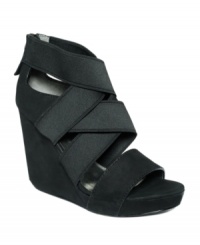 A bevy of stretchy straps surround your legs in cozy style with the Jennifer sandals from the DKNY Bridge Collection. The glam is amped up with an elevated platform and trendy wedge. A bevy of stretchy straps surround your legs in cozy style with the Jennifer sandals from the DKNY Bridge Collection. The glam is amped up with an elevated platform and trendy wedge.
