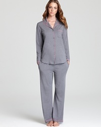 DKNY accents this cotton jersey pajama set with pops of pink for an on-trend lounge look. DKNY accents this cotton jersey pajama set with pops of pink for an on-trend lounge look.