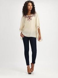 Go boho in a silk-blend poncho blouse with a boatneck, contrasting embroidery and classically draped sleeves. BoatneckLong poncho sleevesAbout 26 from shoulder to hem75% modal/25% silkDry cleanImportedModel shown is 5'9½ (176cm) wearing US size Small. Go boho in a silk-blend poncho blouse with a boatneck, contrasting embroidery and classically draped sleeves. BoatneckLong poncho sleevesAbout 26 from shoulder to hem75% modal/25% silkDry cleanImportedModel shown is 5'9½ (176cm) wearing US size Small.
