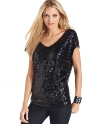 This sequin top from DKNY Jeans adds sparkle to casual days - pair it with jeans or a skirt for an on-trend ensemble. This sequin top from DKNY Jeans adds sparkle to casual days - pair it with jeans or a skirt for an on-trend ensemble.
