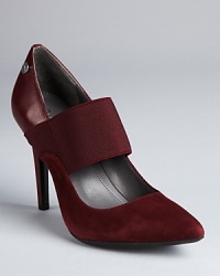 Calvin Klein reinterprets a classic pump, mixing smooth leather with soft suede. Calvin Klein reinterprets a classic pump, mixing smooth leather with soft suede.