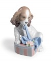 Imagine saying no to this anxious pup! In softly hued porcelain, his tender expression is sure to leave an unforgettable impression on anyone. A perfect gift for the animal lover in your family. 5.25 x 4.75.