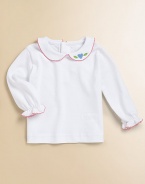 A shirt almost as precious as baby with a classic Peter Pan collar, picot trim and heart appliqué.Peter Pan collarLong sleevesBack buttonsCottonMachine washImported