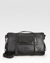 A smart option for any man on the move, styled with flap pockets on the outside and a padded laptop compartment on the inside. Top flap with buckle closures Top handles Adjustable, detachable shoulder strap Exterior flap pockets Interior zip, slip pockets Padded laptop compartment 16½W X 11H X 5D Imported 