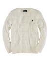 An essential crewneck sweater is rendered in cable-knit cotton for a timeless, preppy aesthetic.