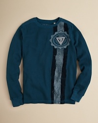 A crewneck pullover rendered in soft waffleknit, adorned with a distressed stripe and logo detail from the left shoulder to hem. A crewneck pullover rendered in soft waffleknit, adorned with a distressed stripe and logo detail from the left shoulder to hem.