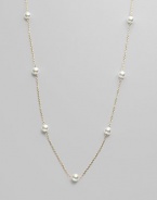 From the Akoya Collection. A delicate chain, enhanced with lustrous white cultured Akoya pearls. 6mm white, round cultured pearls Quality: AA 18k yellow gold Length, about 32 Spring ring clasp Imported