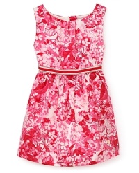 A sleeveless vision of delicate plum-colored flowers spring forth from this floral print dress by Juicy Couture. A sleeveless vision of delicate plum-colored flowers spring forth from this floral print dress by Juicy Couture.