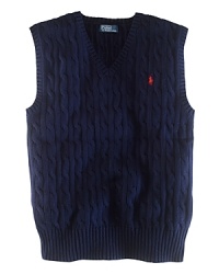 The essential sweater vest is a handsome layer rendered in durable cable-knit cotton. The essential sweater vest is a handsome layer rendered in durable cable-knit cotton.