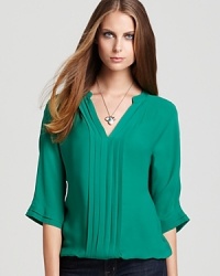 A solid silk stunner, this pretty pleated Joie blouse, moves effortlessly from a casual daytime look with denim skinnies to after-dark chic with the perfect accessories du jour. A solid silk stunner, this pretty pleated Joie blouse, moves effortlessly from a casual daytime look with denim skinnies to after-dark chic with the perfect accessories du jour.