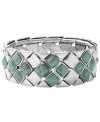Infuse your look with the color of summer year round. Fossil's intricate diamond-patterned bracelet combines reconstituted semi-precious turquoise with silver tone mixed metal. Bracelet stretches to fit wrist. Approximate diameter: 2-1/2 inches.