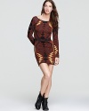 Go for bold in this formfitting Free People dress, boasting a statement-making eclectic print.