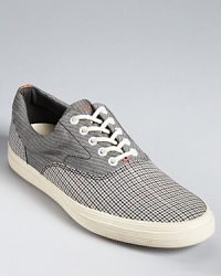 A melange of patterns--check, herringbone and houndstooth--panel these high-design sneakers from Paul Smith for a well-crafted, thoughtful take on modern trends. A melange of patterns--check, herringbone and houndstooth--panel these high-design sneakers from Paul Smith for a well-crafted, thoughtful take on modern trends.