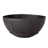 Handcrafted in India, this matte black metal bowl combines a primitive rustic look with all the benefits of modern design. Functioning elegantly as a decorative piece, it can also be used to feature certain foods.