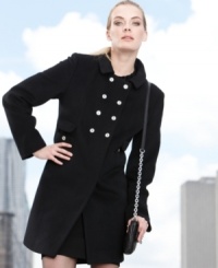 Unique details distinguish Calvin Klein's double-breasted coat from the rest: narrowly set buttons and a small, delicate collar add to the minimalist-chic feel. Unique details distinguish Calvin Klein's double-breasted coat from the rest: narrowly set buttons and a small, delicate collar add to the minimalist-chic feel.
