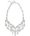 The name says it all. Eliot Danori's all-around Windsor statement necklace brings high shine to any look with its stunning crystal design and rhodium-plated mixed metal setting. Approximate length: 16 inches + 2-inch extender. Approximate drop: 2 inches.