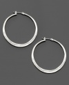Textured for a subtly rustic finish, these mixed metal silvertone hoop earrings are a modern must-have. Each measures 1-1/2 inches in diameter.