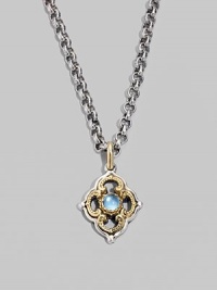 Chic little blossom accent in gleaming sterling silver and 18k gold, centered with a smooth cabochon blue topaz stone. Chain sold separately About ½W X ¾H Imported