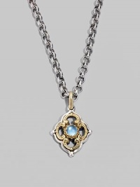 Chic little blossom accent in gleaming sterling silver and 18k gold, centered with a smooth cabochon blue topaz stone. Chain sold separately About ½W X ¾H Imported Chic little blossom accent in gleaming sterling silver and 18k gold, centered with a smooth cabochon blue topaz stone. Chain sold separately About ½W X ¾H Imported