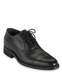Classic refinement meets modern design with this handsome leather oxford from Cole Haan, furnished with Nike Air technology for exceptional comfort all day and all night. Classic refinement meets modern design with this handsome leather oxford from Cole Haan, furnished with Nike Air technology for exceptional comfort all day and all night.