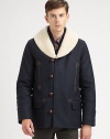 A winter classic topped with a shearling collar, toggle button-front and front pockets with exquisite leather trim.Button-frontChest welt, waist flap pocketsRear ventFully linedAbout 30 from shoulder to hemWoolDry cleanImportedFur origin: Portugal