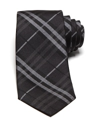 An iconic skinny tie from Burberry London, featuring the brand's signature check print. An iconic skinny tie from Burberry London, featuring the brand's signature check print.