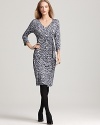 Styled to create a supremely flattering silhouette in a crisp snow leopard print, this BASLER wrap-effect dress finishes in a chic side sash.