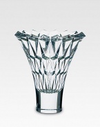 A beautiful crystal vase is handcrafted with a smooth base and diamond-cut facets along the wide, open neck. From the Tornado Collection Full-lead crystal 10 high Hand wash Made in France 