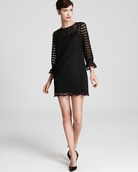 So you've got your little black evening dress. What about your little black go-to for day events? Consider this Milly dress with sheer sleeves for a little does of something different. So you've got your little black evening dress. What about your little black go-to for day events? Consider this Milly dress with sheer sleeves for a little does of something different.