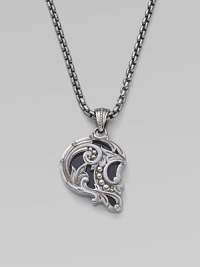 From the No Regrets Collection. It's shaped like a skull in profile, but this pendant is graceful rather than ghoulish, with swirls and curves of sterling silver and inlays of black onyx.Black onyx Sterling silver Necklace length, about 24 Pendant length, about 1 each Lobster clasp Imported