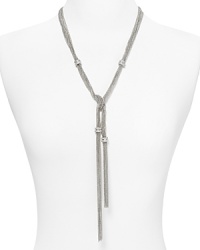 Do the twist with this layered Y-necklace from ABS by Allen Schwartz. Multiple metal chains are accented by dazzling crystal beads and knotted into one striking statement piece. Do the twist with this layered Y-necklace from ABS by Allen Schwartz. Multiple metal chains are accented by dazzling crystal beads and knotted into one striking statement piece.