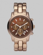 A rose goldtone finish gives a warm glow to a stainless steel chronograph with a lustrous chocolate dial.Quartz movement Water-resistant to 10ATM Polished bezel Round stainless steel case with rose goldtone finish, 42mm (1.69) Chocolate mother-of-pearl dial with crystal hour markers Three chronograph sub dials Date display at 4 o'clock Second hand Rose goldtone-finished stainless steel link bracelet Imported