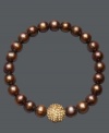 A traditional design receives a sparkling touch. Cultured freshwater pearls (8-9 mm) in shimmery brown hues adorn this chic stretch bracelet, while a gold crystal fireball adds extra glamour. Approximate diameter: 3-1/2 inches.