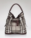 Paired with your workday LBD or weekend denim, Burberry's belted hobo exudes effortless chic.