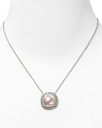 Flash back to glamour with this crystal-rimmed pearl pendant from Majorica. It's a striking showpiece that is sure to add sophisticated sparkle to occasion looks. Flash back to glamour with this crystal-rimmed pearl pendant from Majorica. It's a striking showpiece that is sure to add sophisticated sparkle to occasion looks.