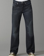 Soft Italian cotton denim in a dark blue denim with subtle fading and whiskering detail. Fading has a slight brown cast Straight-leg, relaxed fit Button fly Five-pocket style Slight distressing on pockets Signature squiggle stitching on back pockets Inseam, about 33¼ Machine wash Made in USA