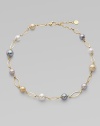 A gorgeous blend of different colored pearls with 18k goldplated sterling silver links. 10mm and 12mm round white, champagne, grey and black organic hand-made pearls 18k goldplated sterling silver Lobster clasp closure Length, about 16 to 18 adjustable Imported 
