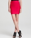 Hot color and subtle seaming detail balance each other on this so-slim knitted skirt.