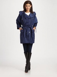 A double-breasted A-line design featuring a fold-over collar, a convenient hood and front pockets. Attached hoodThree-quarter sleevesButton closureFront pocketsBelted designAbout 34 from shoulder to hemNylonHand washImportedModel shown is 5'9½(176cm)wearing US size 4. A double-breasted A-line design featuring a fold-over collar, a convenient hood and front pockets. Attached hoodThree-quarter sleevesButton closureFront pocketsBelted designAbout 34 from shoulder to hemNylonHand washImportedModel shown is 5'9½(176cm)wearing US size 4.