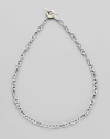 Sterling silver and 18k gold small figaro chain. Toggle closure 18 long Imported