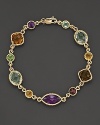 Blending a gorgeous array of colorful gemstones with 14 Kt. yellow gold, this station bracelet will complement all of your favorite looks.