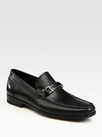 Signature hardware distinguishes these sleek leather slip-ons, crafted in Italy.Leather liningPadded insoleRubber soleMade in Italy Signature hardware distinguishes these sleek leather slip-ons, crafted in Italy.Leather liningPadded insoleRubber soleMade in Italy